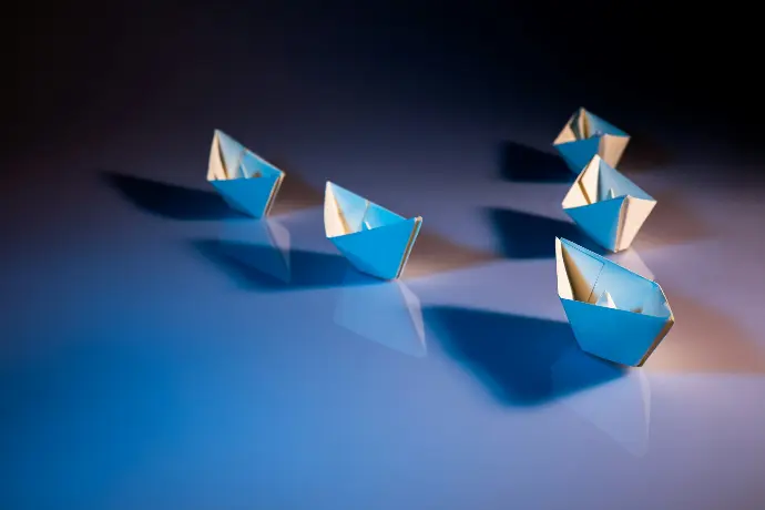 white paper boats on white surface